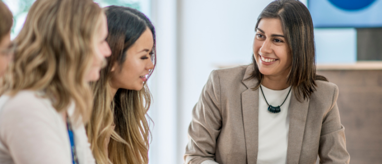 A group of women leaders are collaborating and working together building accountability through leadership development.